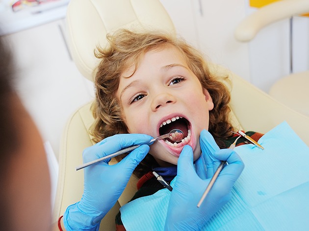 Mother and daughter next to each other with woman wearing braces