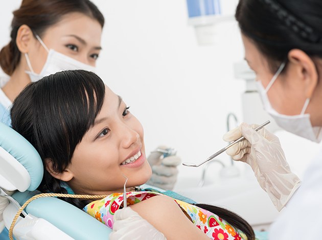 Teen patient interacting with dentist