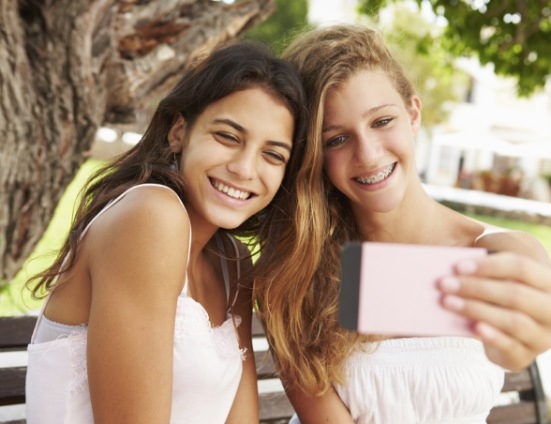 Two teenage girls taking selfie together
