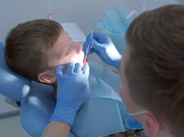 Young boy receiving a dental exam