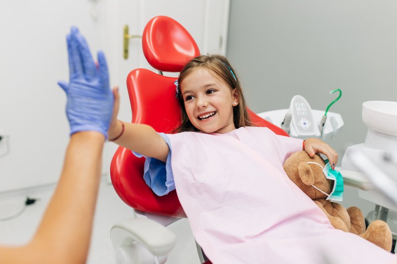 Kid high-fives dentist
