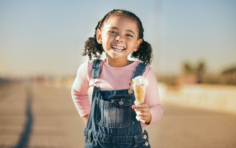 Young patient without cavities enjoying ice cream